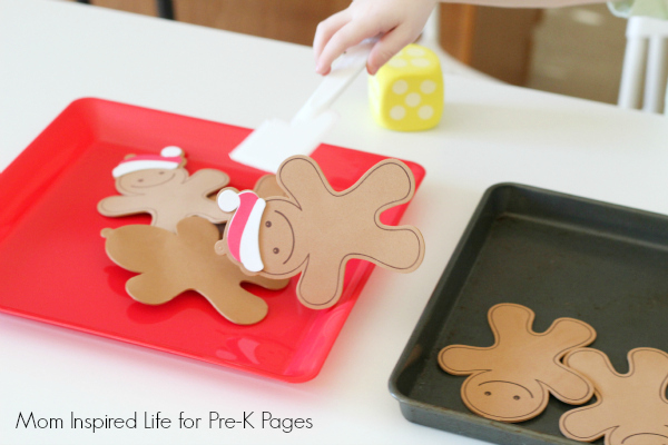 putting gingerbread cutouts onto a plate